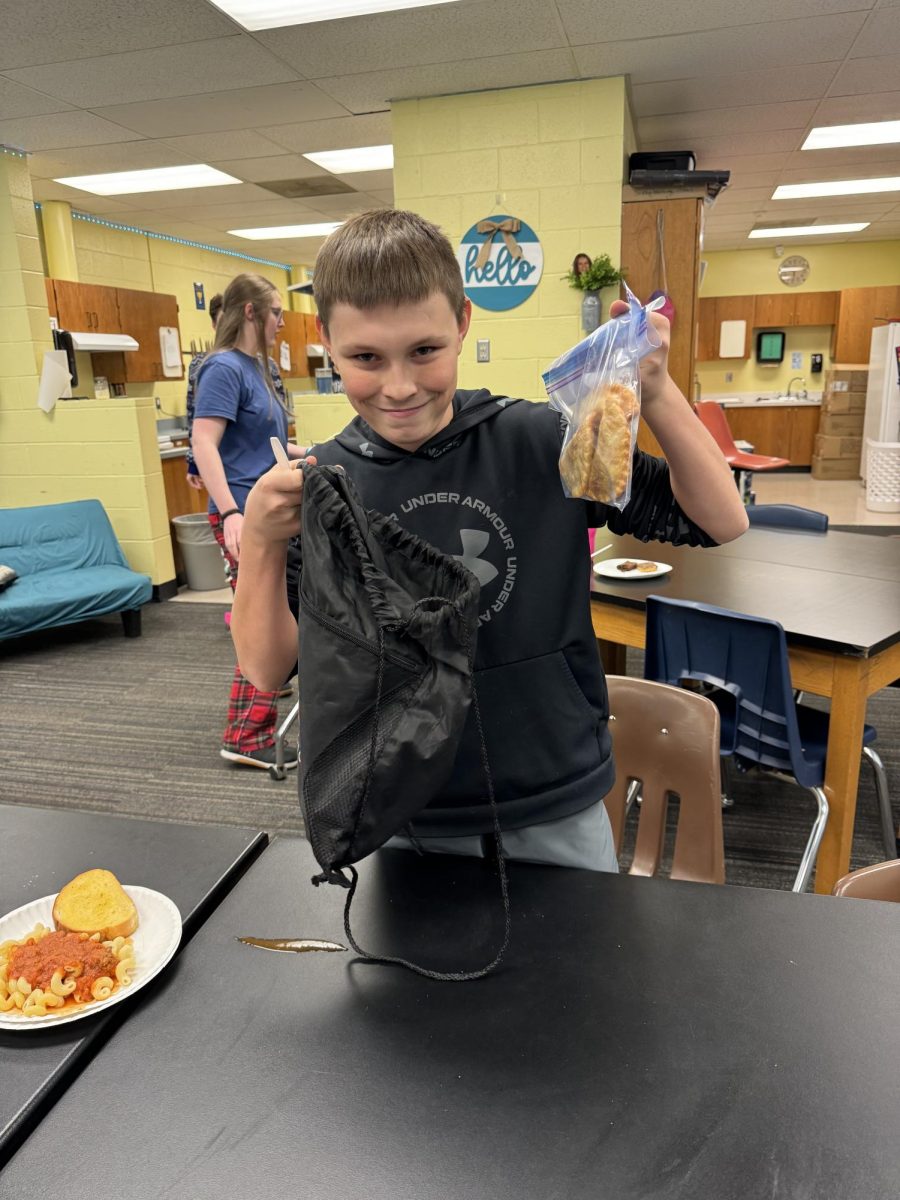 Owen shows off his to-go meal. 