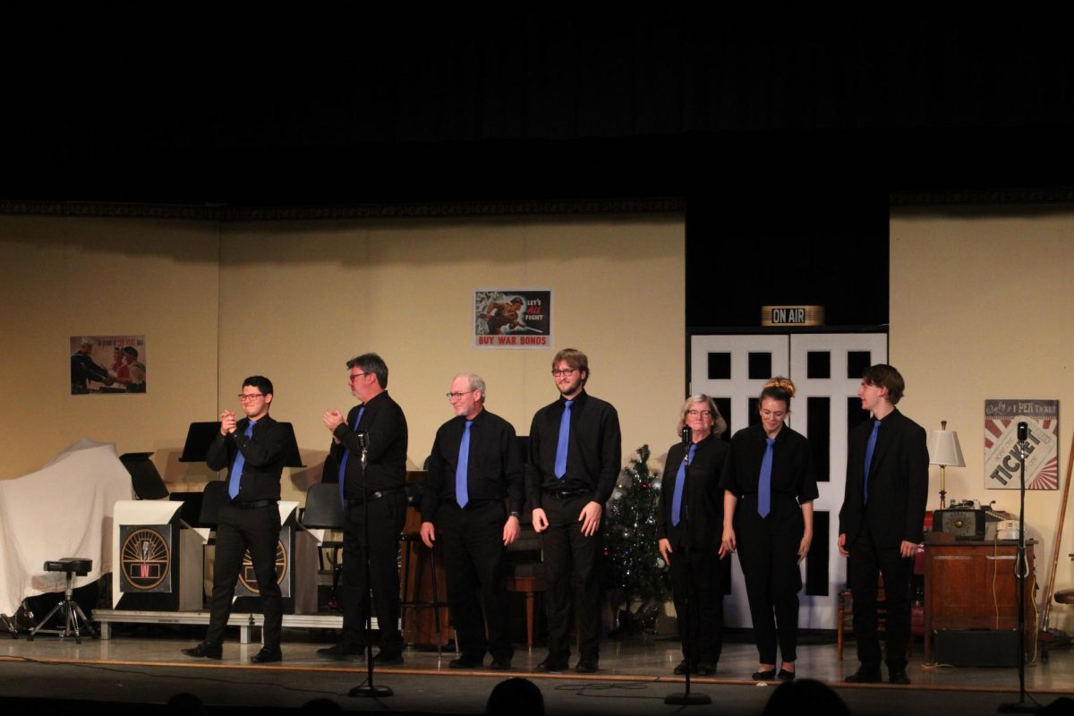 The on-stage jazz band participating in 1940s Radio Hour take their final bow on closing night of the show.