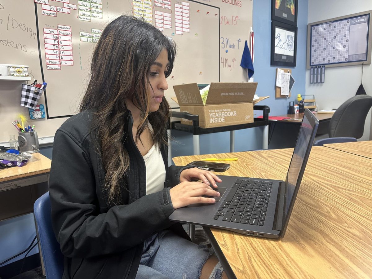 Hard at work, junior Brooklyn Gibbs is starting to work towards her next yearbook deadline which is an FBLA spread that will be submitted by March 7, 2025. 