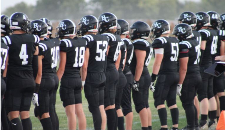Kickoff! The Mustangs prepare to take the field as the opening kickoff takes place.