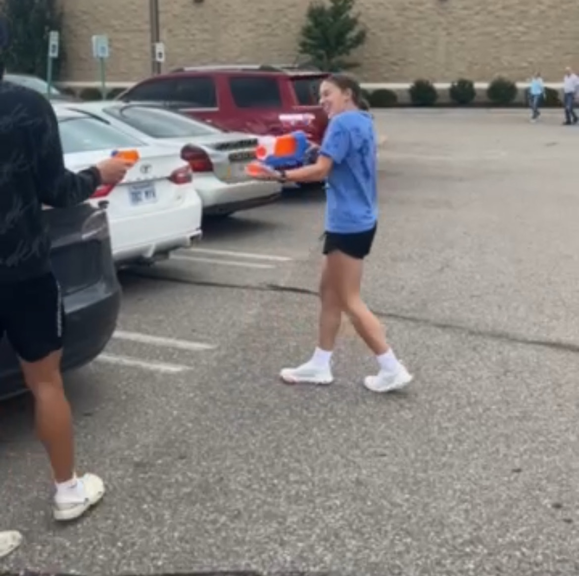 Screen capture from Instagram. Seniors Brooklyn Dye is defending herself against senior Dylan Jones during a "purge" at The Manhattan Town Center Mall parking lot. 