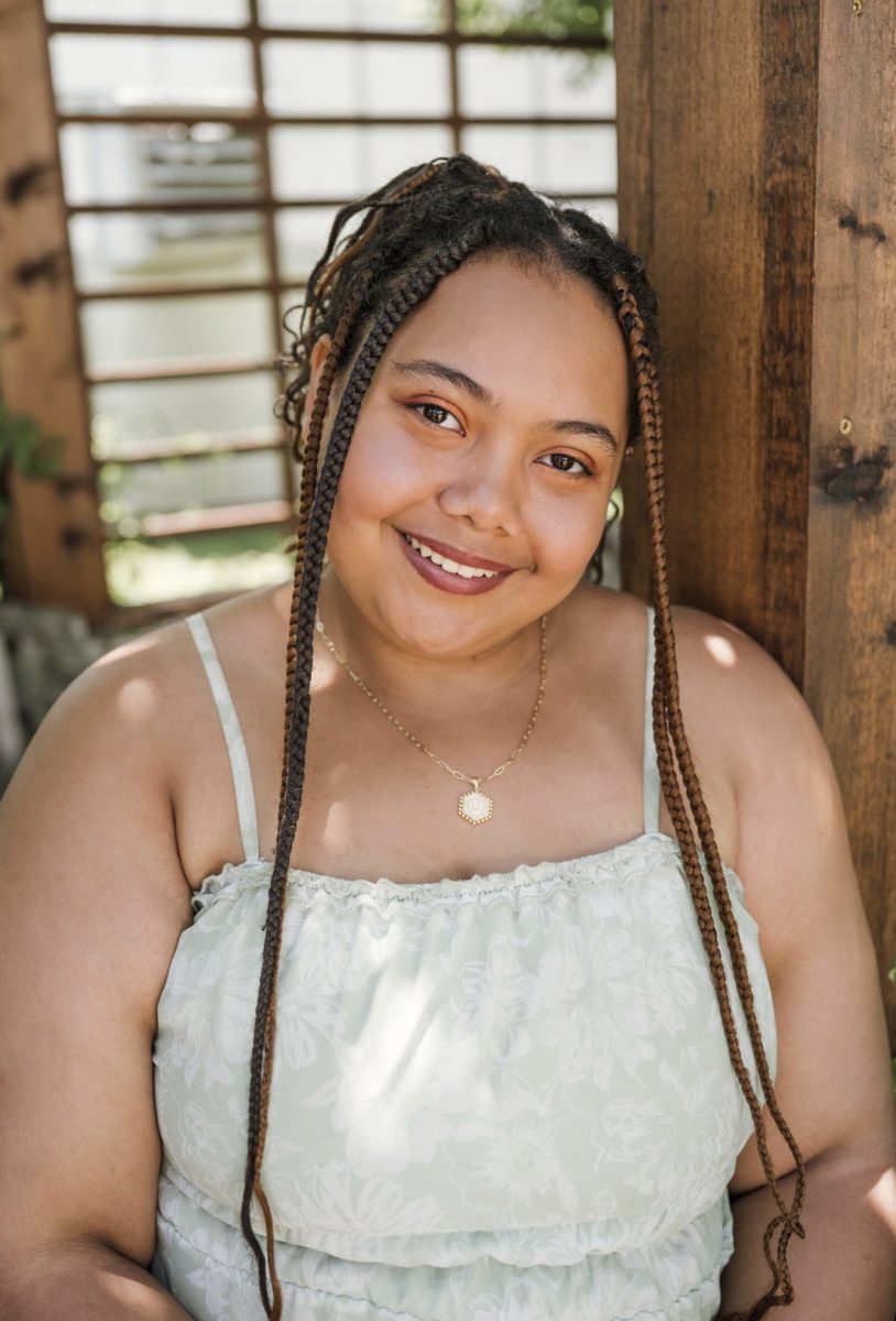 Senior Olivia Bowman balances big responsibilities and big school spirit as Rock Creek’s yearbook business manager and a a member of the flag team.