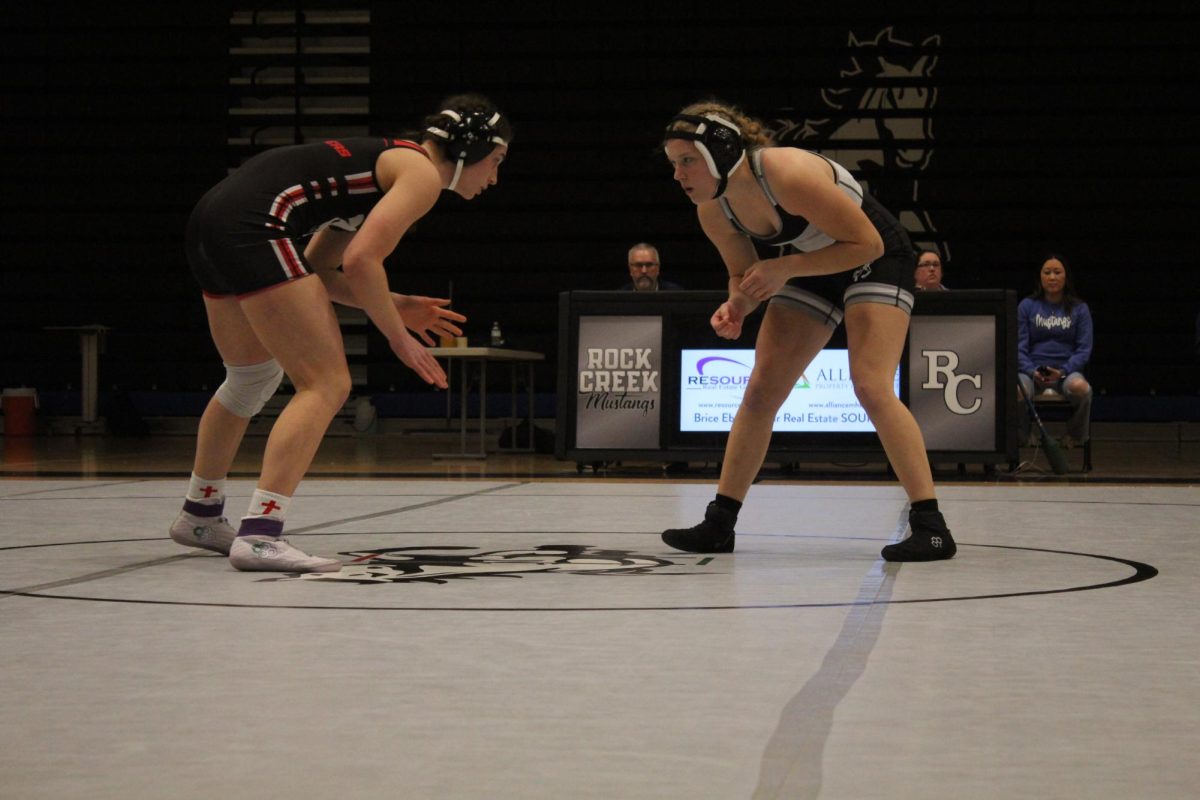 Facing off again. Sophomore Megan Ryan is ready to wrestle junior Gabi Lange from Concordia High School on Jan. 29, 2025 at THE ROCK. Ryan's previous loss in a match against Lange became her driving force to reach a higher level this season.