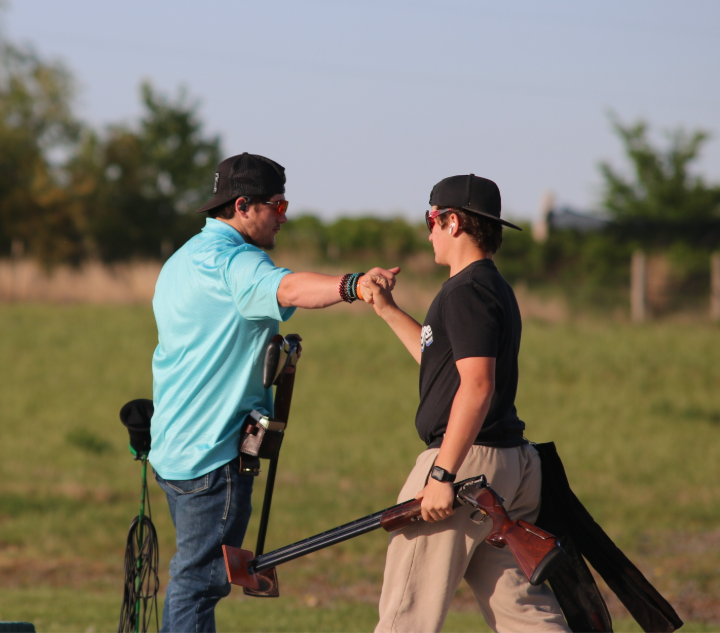 Team Captain Devon Helget and freshman Graden Stefek at practice on Wednesday, Apr. 29. at the Tuttle Creek Shooting park in Manhattan, Kansas.